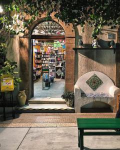 an entrance to a store with a bench in front at Casa Sabrina in San Vito lo Capo