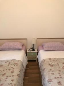 Postel nebo postele na pokoji v ubytování Apartmani Matea