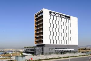 a building with a mgm sign on it at Workinn Hotel in Gebze