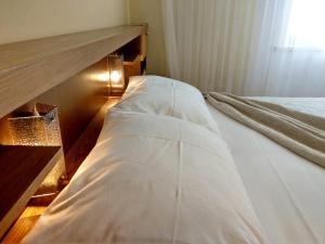 Ein Bett oder Betten in einem Zimmer der Unterkunft Holiday House Palma