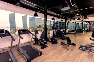 a gym with treadmills and cardio equipment in a building at Almar Resort Luxury LGBT Beach Front Experience in Puerto Vallarta