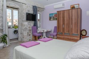 Posteľ alebo postele v izbe v ubytovaní Devivi Apartments