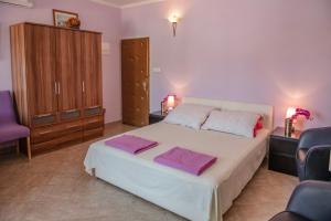 Posteľ alebo postele v izbe v ubytovaní Devivi Apartments