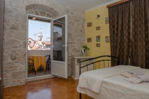 Posteľ alebo postele v izbe v ubytovaní Devivi Apartments