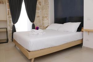 Postel nebo postele na pokoji v ubytování La Nicchia B&B