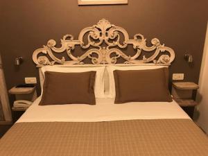 Postel nebo postele na pokoji v ubytování Hotel Villa Esedra