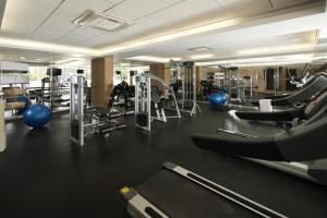 a gym with a lot of treadmills and machines at Casa Andina Select Chiclayo in Chiclayo