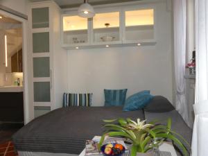 a bedroom with a bed and a table with a plant at Torhaus in Lüneburg