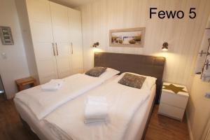 Ein Bett oder Betten in einem Zimmer der Unterkunft Apartment Seeteufel
