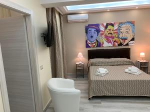 Postel nebo postele na pokoji v ubytování B&B In Centro