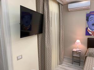TV a/nebo společenská místnost v ubytování B&B In Centro