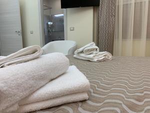 Postel nebo postele na pokoji v ubytování B&B In Centro