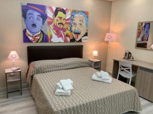 Postel nebo postele na pokoji v ubytování B&B In Centro