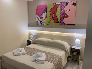 Postel nebo postele na pokoji v ubytování B&B In Centro