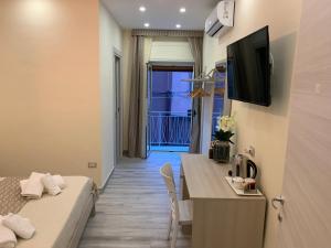 TV a/nebo společenská místnost v ubytování B&B In Centro