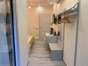 TV a/nebo společenská místnost v ubytování B&B In Centro
