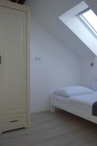 Postel nebo postele na pokoji v ubytování Apartmány Charlie