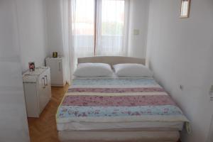 Ліжко або ліжка в номері Apartments Ana