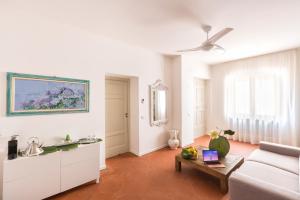 a living room with a couch and a table at Villa Zagara - La Serra in Sorrento