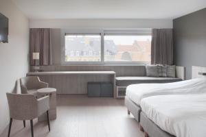 Postelja oz. postelje v sobi nastanitve B&B 't Withuis