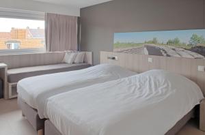 Postelja oz. postelje v sobi nastanitve B&B 't Withuis