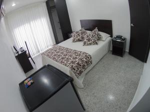 Postel nebo postele na pokoji v ubytování Hotel Las Molas