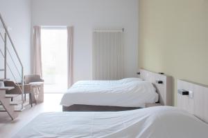 Postelja oz. postelje v sobi nastanitve B&B 't Withuis