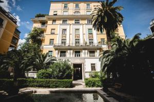 a building with a pool in front of it at PRATI 1930 Boutique apartments Rome in Rome