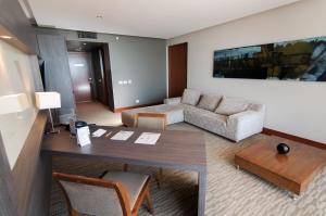 a living room with a table and a couch at Enjoy Antofagasta in Antofagasta