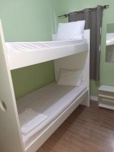 Postel nebo postele na pokoji v ubytování Hotel Aruba