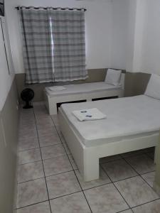 Postel nebo postele na pokoji v ubytování Hotel Aruba