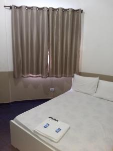 Postel nebo postele na pokoji v ubytování Hotel Aruba