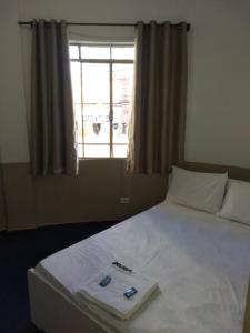 Postel nebo postele na pokoji v ubytování Hotel Aruba