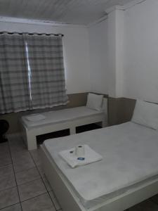 Postel nebo postele na pokoji v ubytování Hotel Aruba
