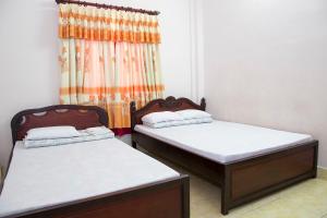 Кровать или кровати в номере Song Hung Hotel