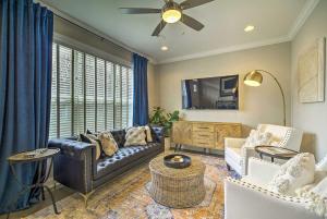 a living room with a couch and a tv at Downtown Retreat in Chattanooga