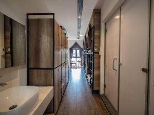 a large bathroom with a sink and a tub at Wings House in Danang +37 photos