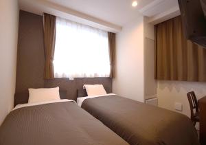 Postel nebo postele na pokoji v ubytování Hotel Trend Tobu Asakusa-Eki Kita + 37 fotografií