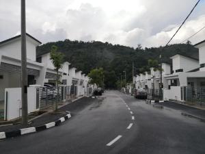 an empty street in a town with white houses at Aliya Villa Pulau Langkawi House in Kuah