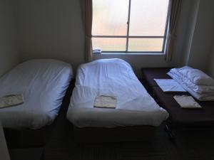 Postel nebo postele na pokoji v ubytování Best Hotel