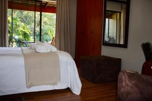 Green Pascua Bed and Breakfast客房内的一张或多张床位