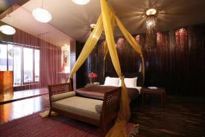 Postel nebo postele na pokoji v ubytování Chateau Boutique Motel