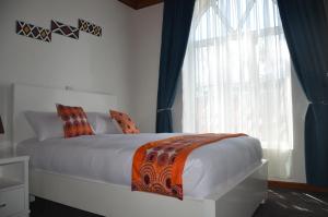 Ein Bett oder Betten in einem Zimmer der Unterkunft Villa Asimba