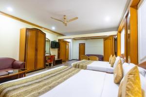 Postel nebo postele na pokoji v ubytování Garden Hotel