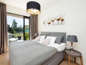 Ένα ή περισσότερα κρεβάτια σε δωμάτιο στο One Apartments
