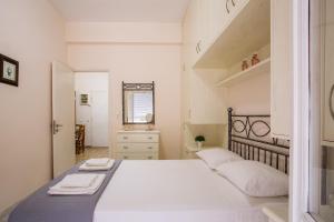 Postel nebo postele na pokoji v ubytování Beautiful Corfu City Apartment