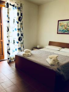 Postel nebo postele na pokoji v ubytování Casa Vacanza "La Piazzetta"