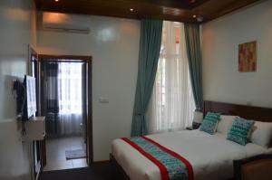Ein Bett oder Betten in einem Zimmer der Unterkunft Villa Asimba