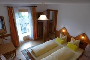 a living room with a couch and a window at Haus Salzburgerland in Mauterndorf