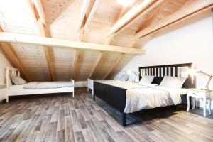 Postel nebo postele na pokoji v ubytování Apartmány MALIK